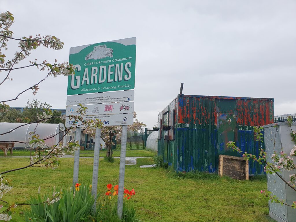 the sign outside the community garden